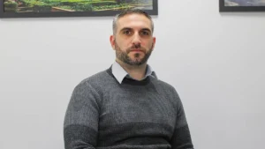 Facades & Cladding Head of Commercial Daniel Rotryng sat down for an interview, in a room with a white background.