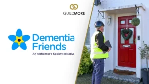 Banner showing Male Guildmore employee in front of a red door, with a Dementia Friends on the left